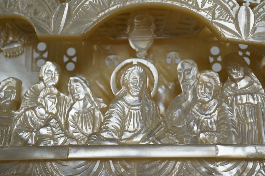 A mother of pearl carved scene of The Last Supper, on easel, 18cm wide. Condition - good